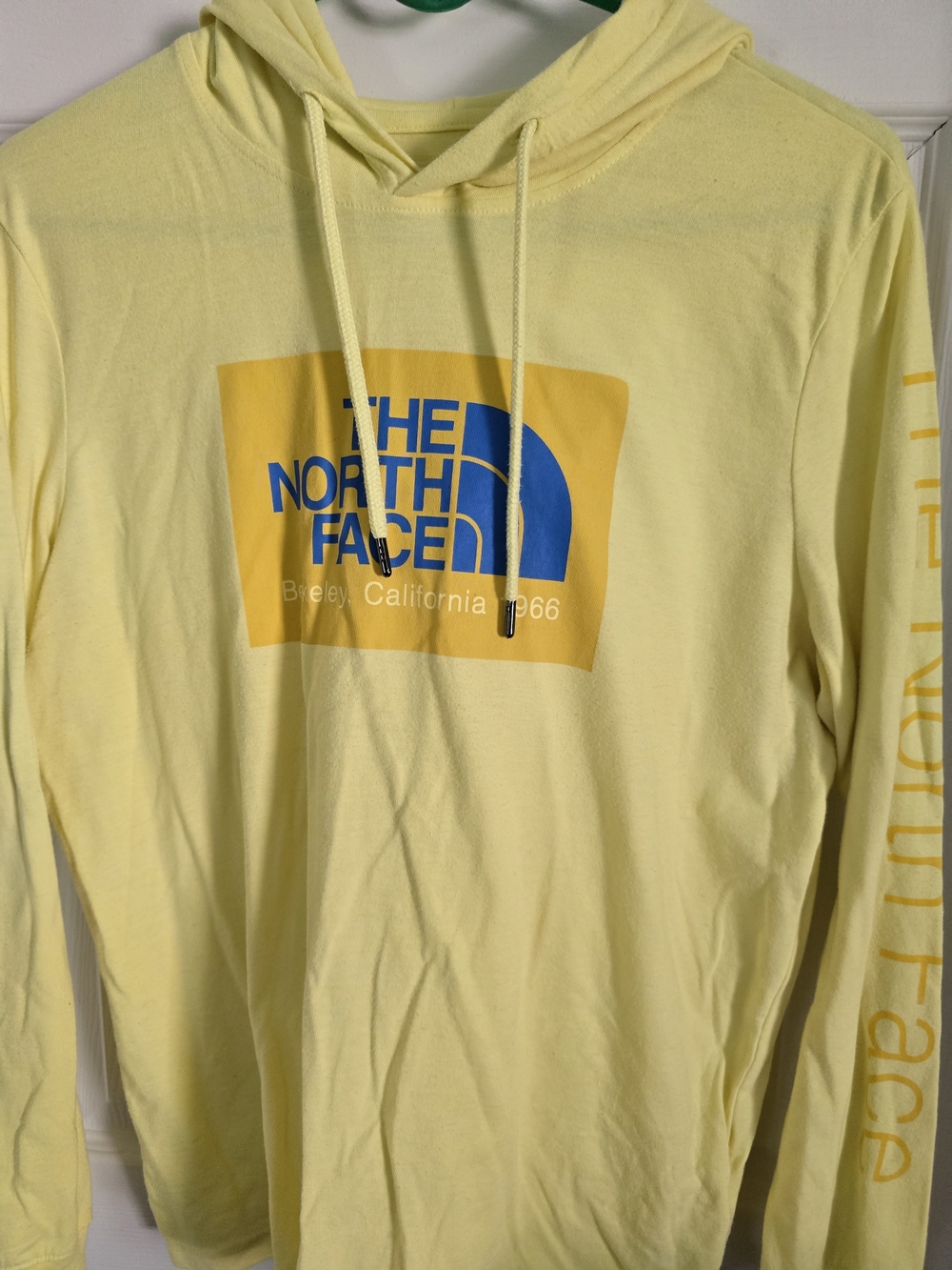 The North Face Pale Yellow Crewneck Hoodie with Blue Logo